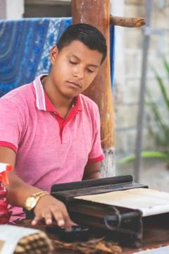 Man making cigars. Stock Photos