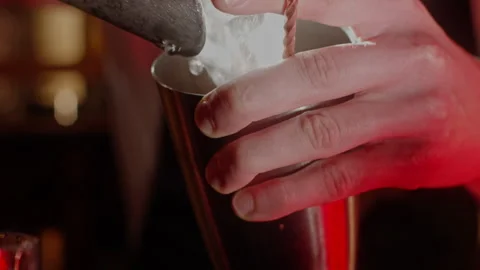 Man making a cocktail in a bar Stock Footage 255703684