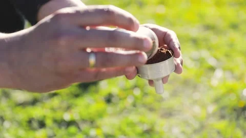 Man making coffee in moka pot at nature outdoor Video stock 204086850