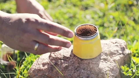 Man making coffee in moka pot at nature outdoor Stock Footage 204086919