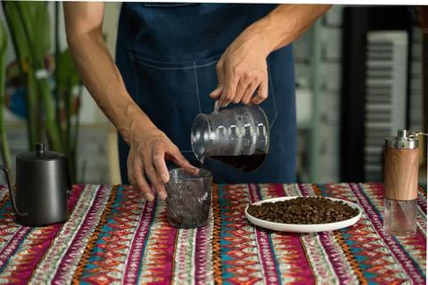 A man is making coffee Stock Photos