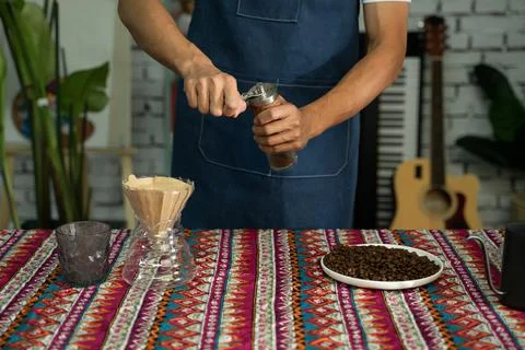 A man is making coffee Stock Photos
