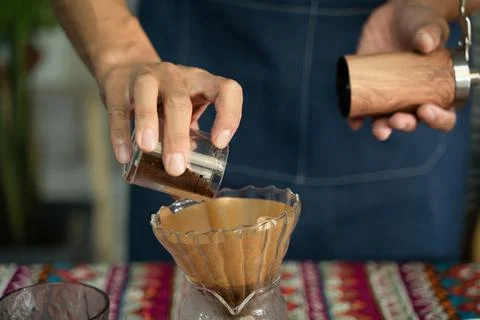 A man is making coffee Stock Photos