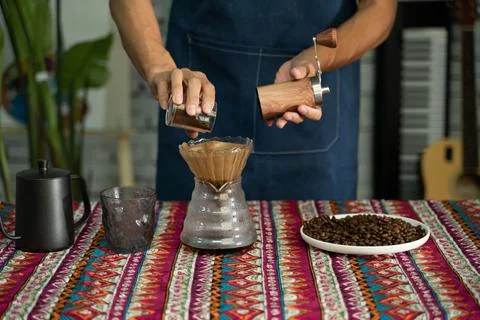 A man is making coffee Stock Photos