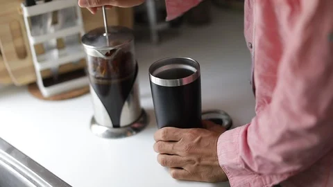Man making a coffee takeaway with french press. Slow Motion. Stock Footage 127796060