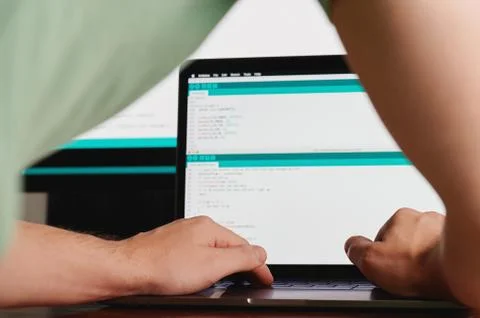 Man making computer code Stockfoto's