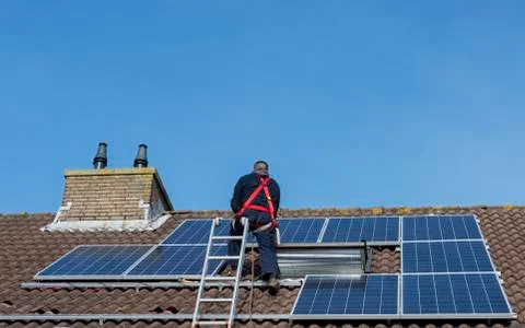 Man making construction with solar panels Stock Photos