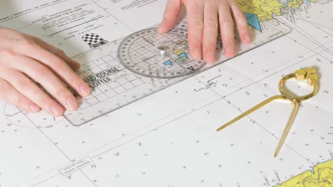Man is making a course on the nautical map Stock Footage 85516868