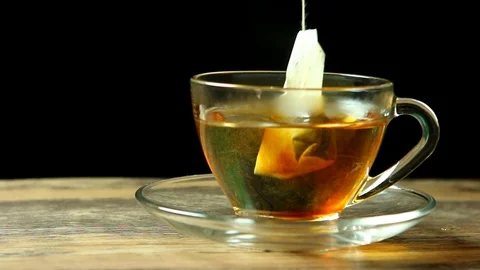 Man making a cup of tea, close up in studio Stock Footage 103034272