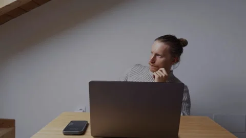 Man making decision while working remotely on laptop at home Stock-Footage 334735967