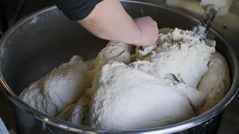 Man making dough in dough kneading machine. Stock Footage 234915001