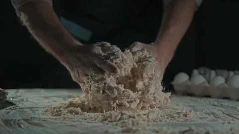 Man making dough for pizza or pie Stock Footage 240228642