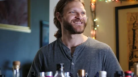 Man making drinks behind bar Stock Footage 154761904