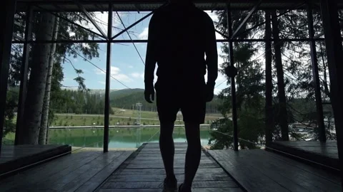 Man making exercises in slow motion on a viewing mountains spot Video stock 200499040