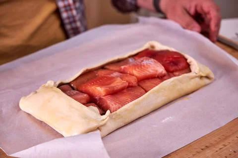 A man is making a fish pie. View from above Stock Photos
