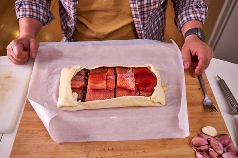 A man is making a fish pie. View from above Stockfoto's