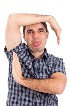 Man making funny faces, gestures and sticking out tongue Stock Photos