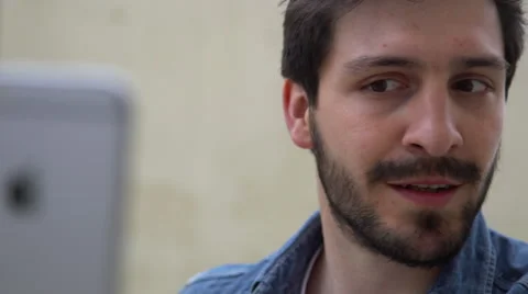 Man making funny faces while taking a selfie Stock Footage 63300349