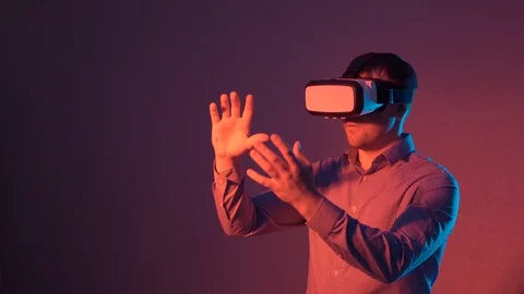 Man making gestures while using VR glasses Stock Footage 101753564