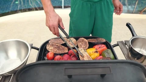 The man is making grilled vegetables Stock Footage 159329835