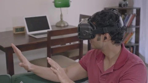 A man making hand gestures/ movement using 3D glasses Stock Footage 126998430