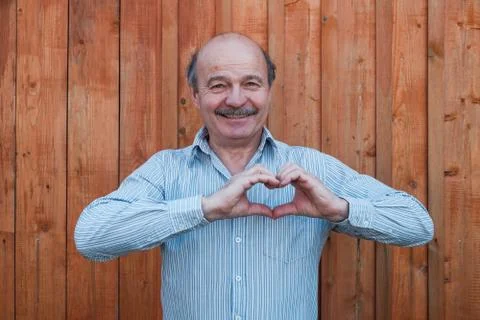 Man making a hand heart frame Stock Photos