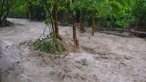 A man making his way through the rubble at a flood Video stock 158433013