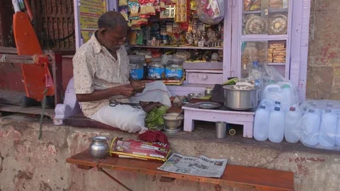 Man Making Indian Pan in his shop in Varanasi Stock Footage 82252914