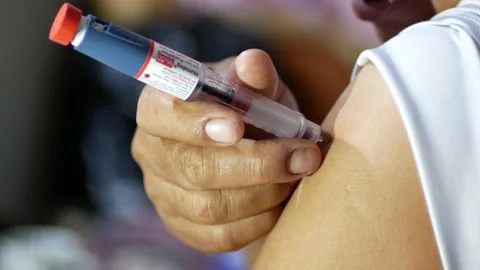 Man is making insulin injection in his arm. Stock Footage 232975480