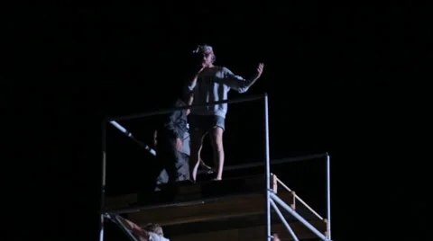 Man Making a Jump From A tower to The Big Airbag at night Stock Footage 59894037