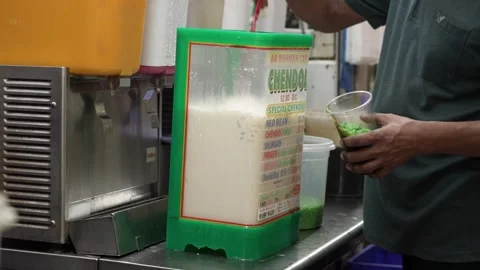 Man making local drink at hawker centre in Singapore Stock Footage 247637839