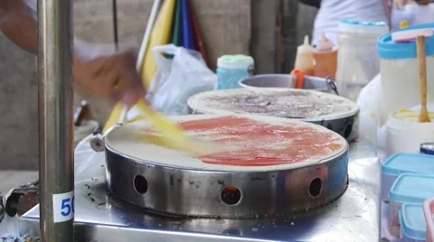 Man making local pancakes crape Stock Footage 50525819