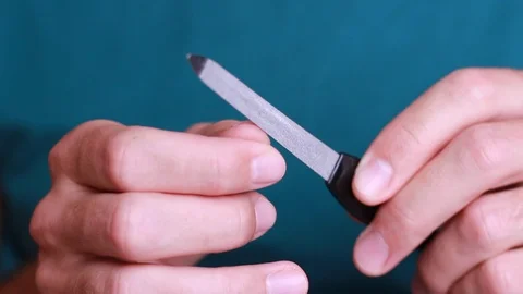 Man making manicure himself 動画素材 90442653