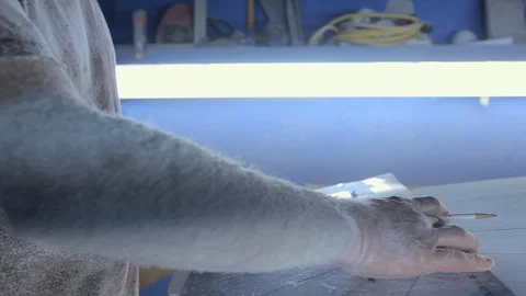 Man making new surfboard Stock Footage 136556939