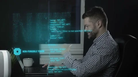 Man making NFT code on a laptop Stock Footage 170499293