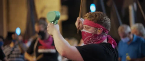 Man making noise during a night protest Stock Footage 152848069