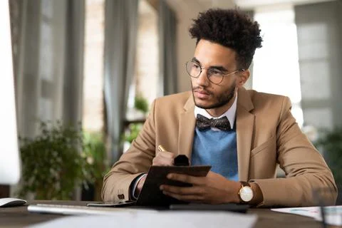 Man making notes in notebook Stock Photos