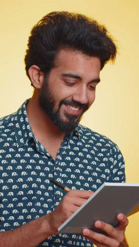Man making notes, writing down thoughts with pen into notepad notebook diary, to Stock Footage 347553488