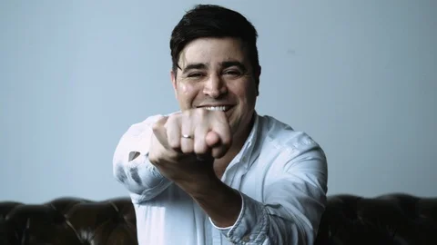 Man Making Obscene Hand Sign at Camera Stock Footage 120427604