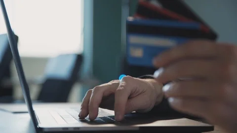 Man making online shopping, using computer and plastic card Stock Footage 119462463