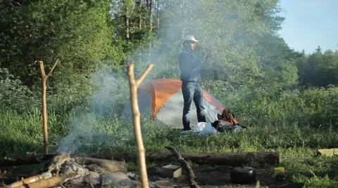 Man making photo with camera in camping Stock Footage 64050149