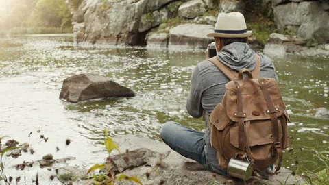 Man making pictures with a camera while traveling. Stock Footage 95197804