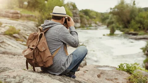 Man making pictures with a camera while traveling. Stock Footage 95198604