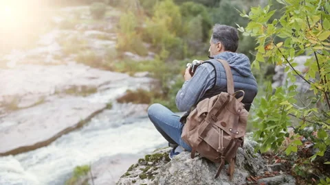Man making pictures with a camera while traveling. Stock Footage 95199237