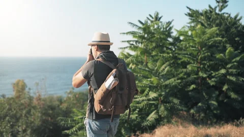 Man making pictures with a retro camera while traveling . Stock Footage 94573795