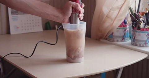 Man making a protein shake at home Stock Footage 124356988