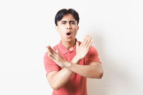 Man making a rejection gesture with both hands, expressing refusal, stop, w.. Stock Photos