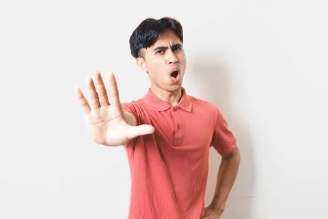 Man making a rejection gesture with both hands, expressing refusal, stop, w.. Stock Photos