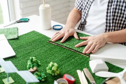 Man making renewable energy project dummy. Stock Photos