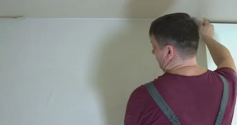 A man is making repairs in an apartment. Video stock 306866456